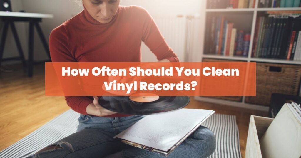 a woman in red shirt cleaning vinyl record